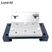 A metal mounting bracket assembly with a brushed silver aluminum plate and a black base plate, shown on a plain white background with the text 'Lund 42' in the top left. Beatdown Sport Track Breakaway Transducer Pole