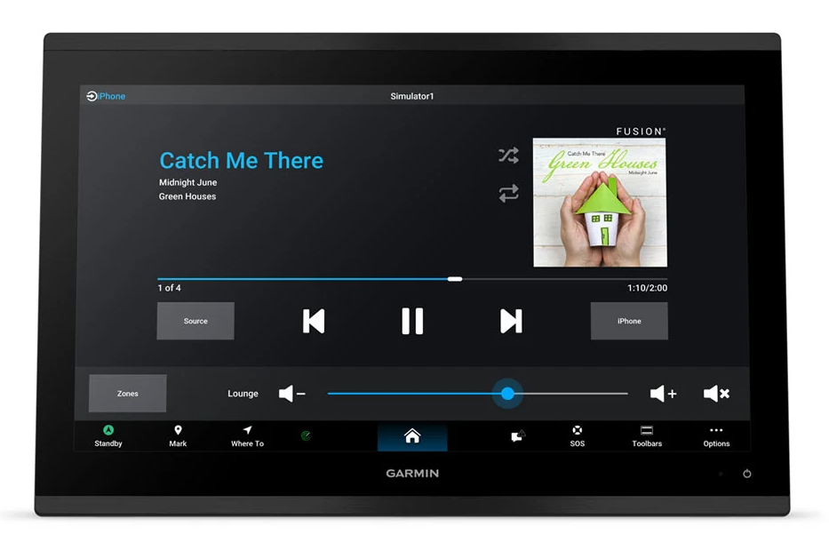 A Garmin touchscreen display device, likely an automotive infotainment or navigation screen, shown on a clean white background. The screen is active, displaying the Spotify app interface with the song 'Catch Me There' by Green Houses, alongside a Spotify and Fusion logos.